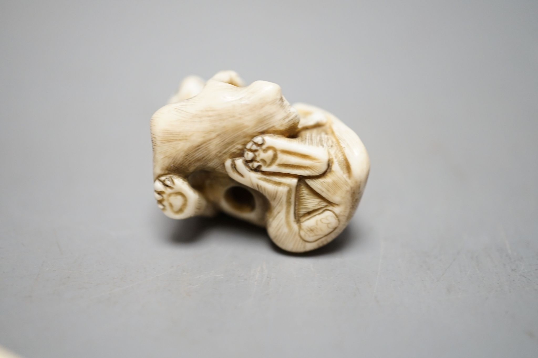 A 19th century ivory netsuke cat group and a Meij period ivory shibayama bezique marker, 9cm.